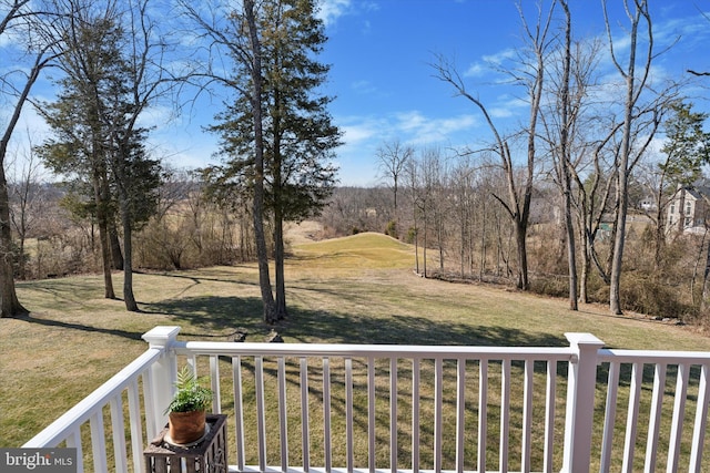 view of yard with a balcony