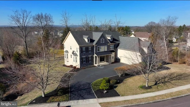 view of front of property featuring stucco siding and driveway