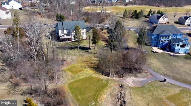 birds eye view of property with a residential view