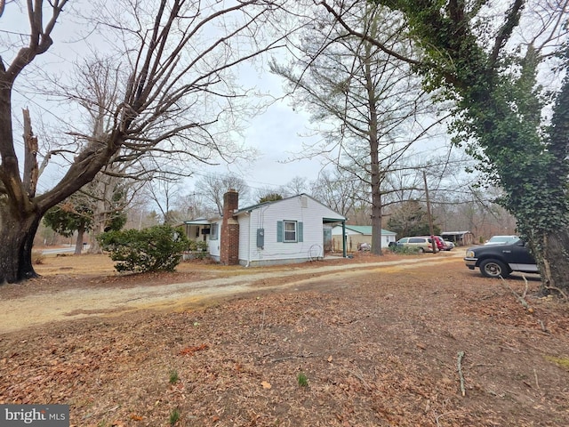 exterior space featuring a chimney