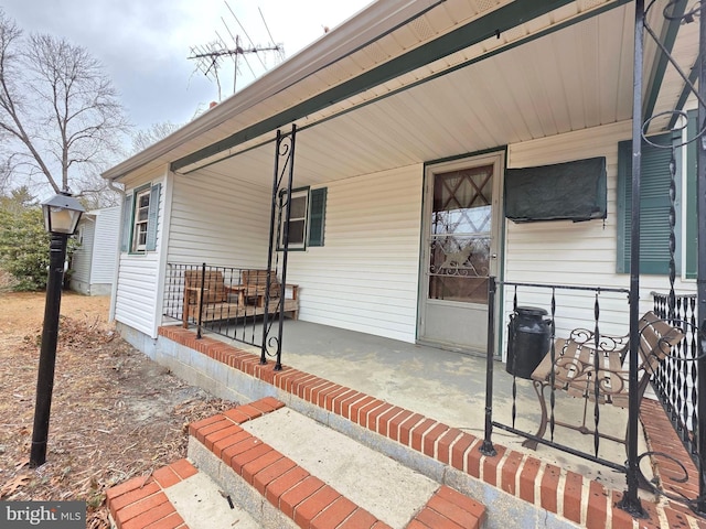 property entrance featuring covered porch