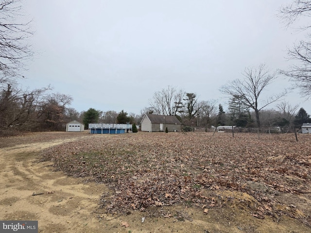 view of yard with a shed and an outdoor structure