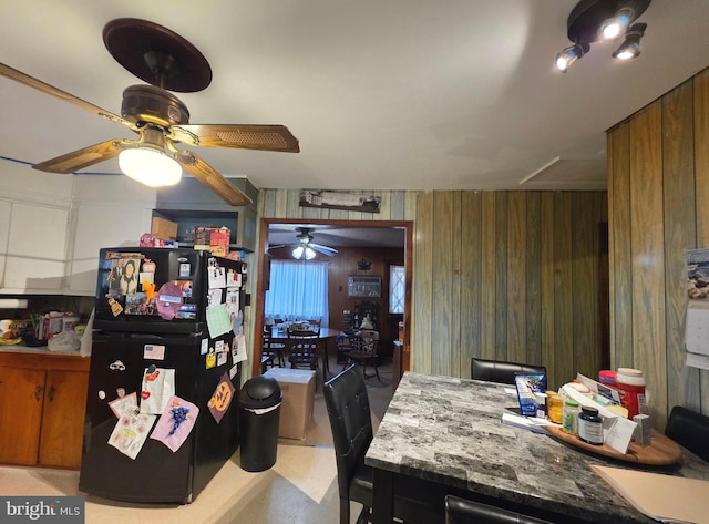 dining room with wooden walls