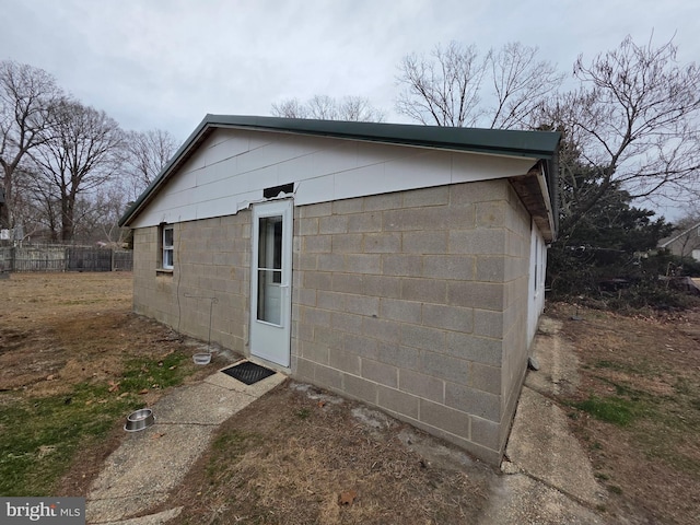 view of outbuilding with fence