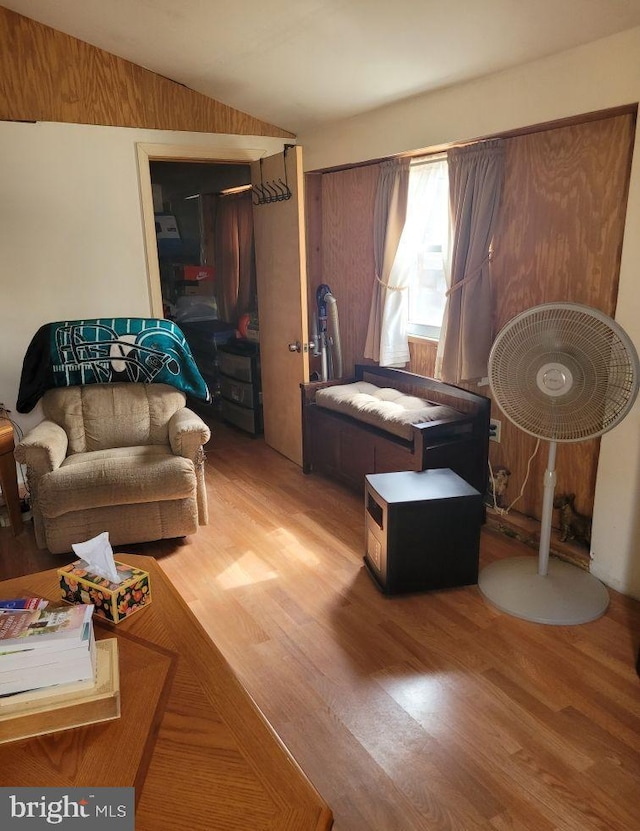 interior space with vaulted ceiling and wood finished floors