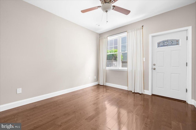 entryway featuring ceiling fan, baseboards, and wood finished floors