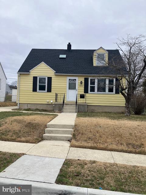 view of front of home featuring roof with shingles