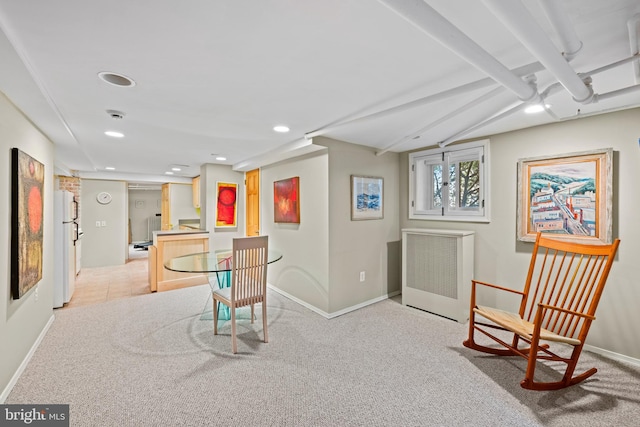 sitting room with radiator heating unit, carpet flooring, baseboards, and recessed lighting