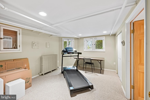 workout room with radiator heating unit, carpet flooring, and baseboards