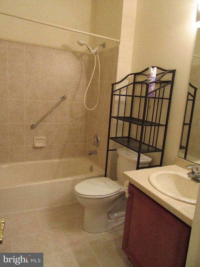 bathroom featuring tub / shower combination, vanity, toilet, and tile patterned floors