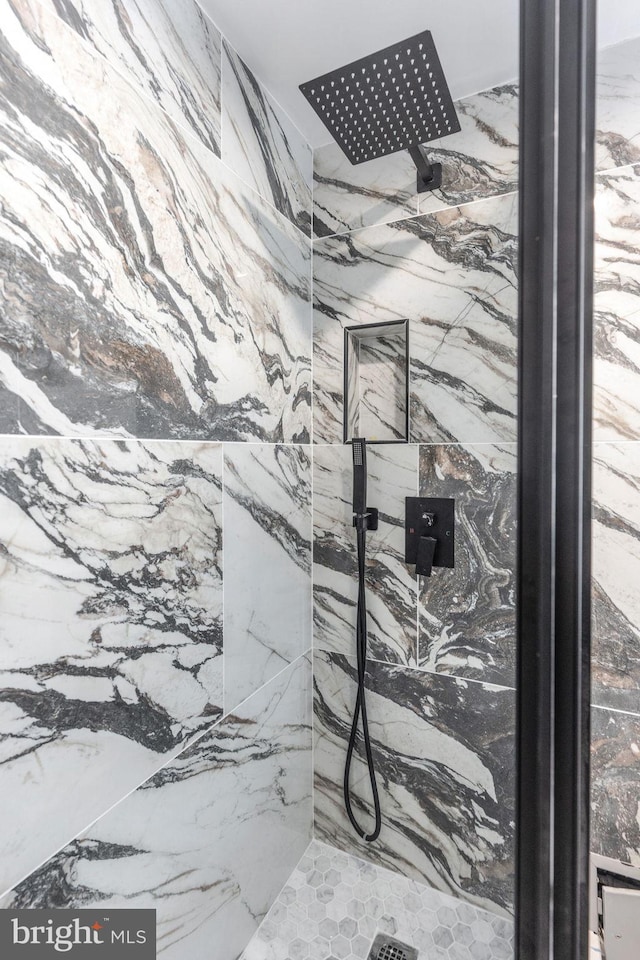 room details with a marble finish shower