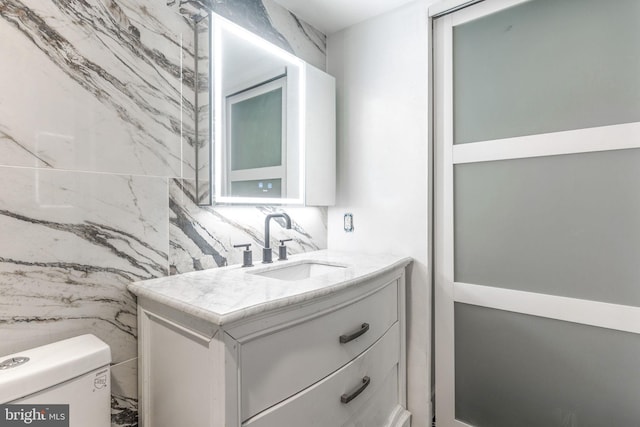 bathroom with toilet and vanity