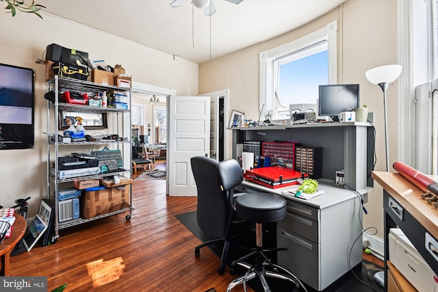 office space featuring a ceiling fan, plenty of natural light, and wood finished floors