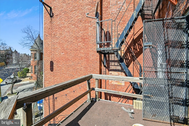 view of side of home with brick siding