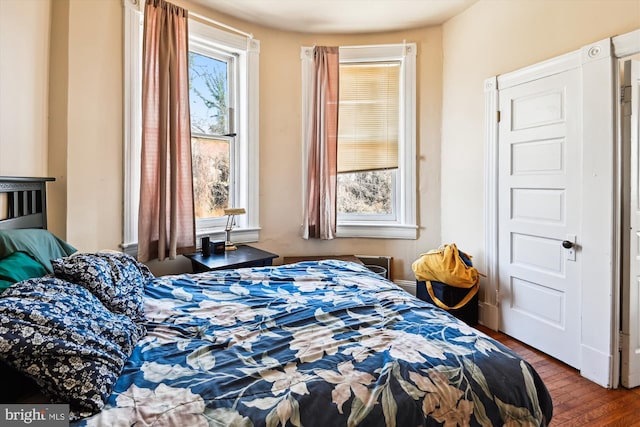 bedroom featuring wood finished floors