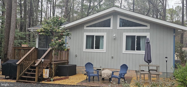 view of property exterior with crawl space, central AC, and a patio area