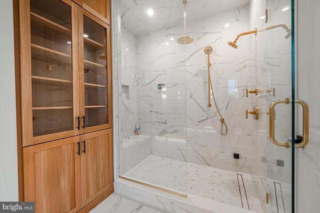 full bathroom featuring marble finish floor and a marble finish shower