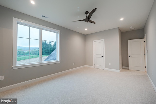 unfurnished bedroom with light carpet, visible vents, baseboards, a ceiling fan, and recessed lighting