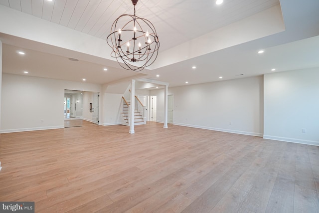 unfurnished living room with baseboards, light wood-style floors, and recessed lighting