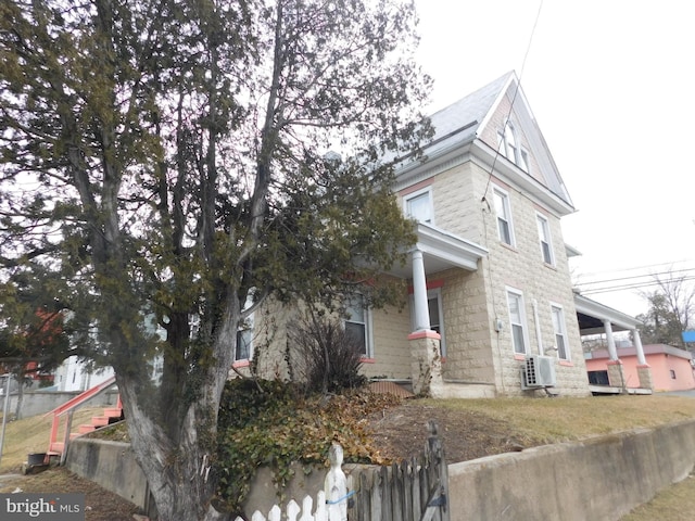 view of property exterior with fence