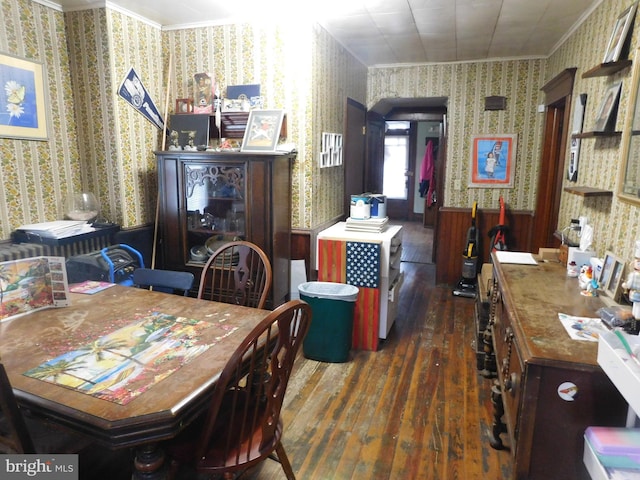 dining area featuring wallpapered walls, wood-type flooring, and ornamental molding