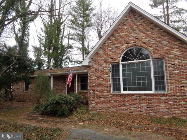 view of home's exterior with brick siding