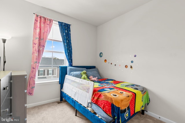 carpeted bedroom with baseboards