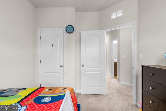 bedroom with light carpet, baseboards, and visible vents