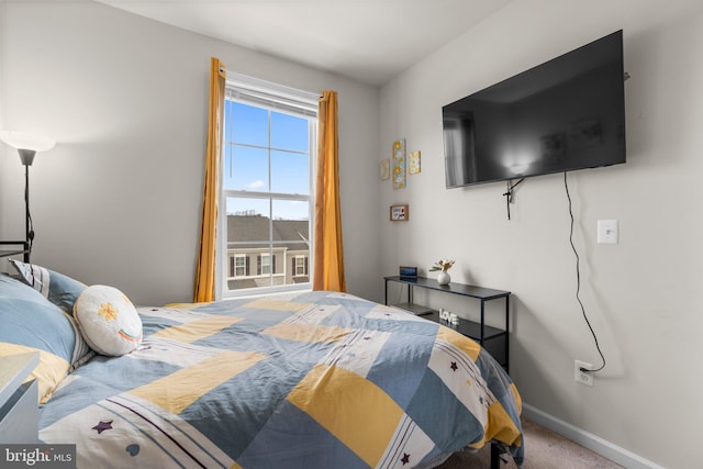 carpeted bedroom with baseboards