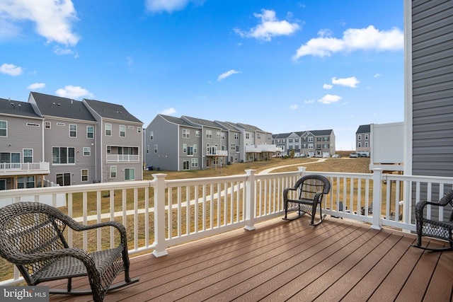 wooden terrace featuring a residential view