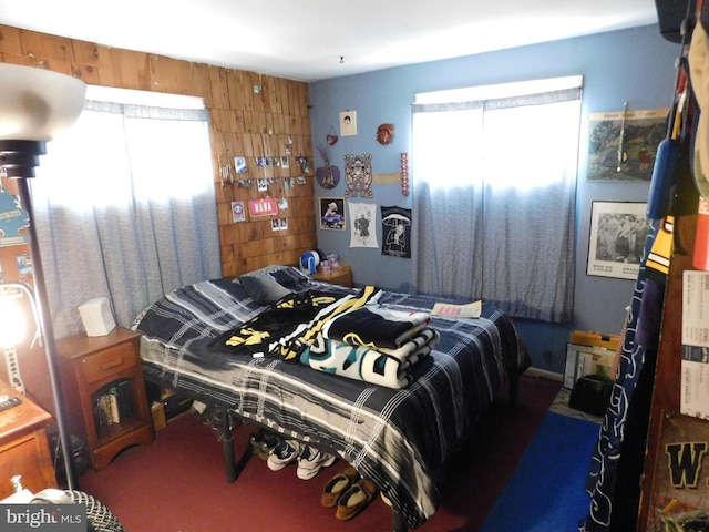 bedroom featuring carpet and multiple windows