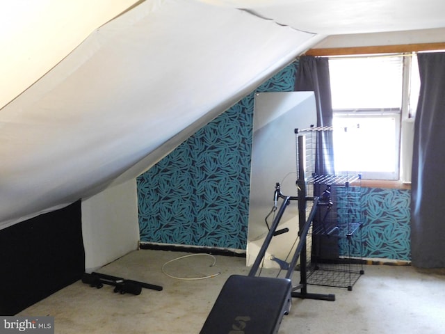 exercise room with lofted ceiling