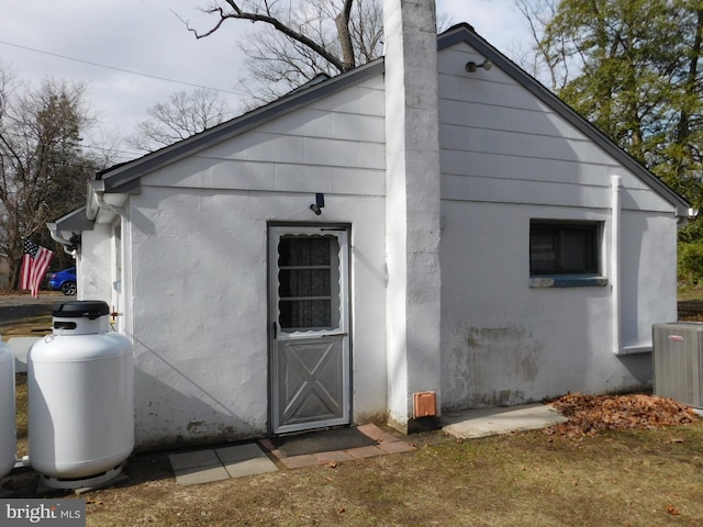 exterior space featuring central AC and stucco siding