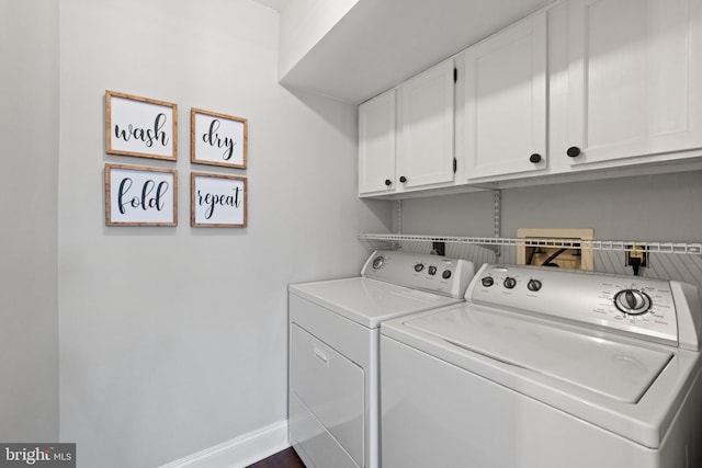 washroom with washer and clothes dryer, cabinet space, and baseboards