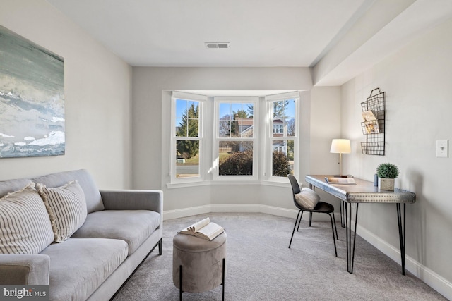 office area featuring carpet, visible vents, and baseboards