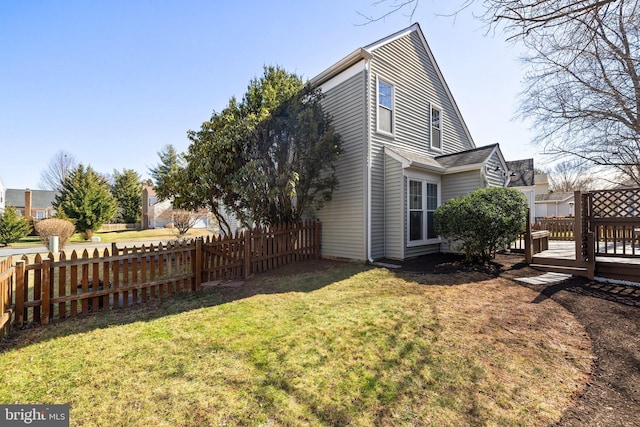 exterior space featuring a fenced backyard and a deck