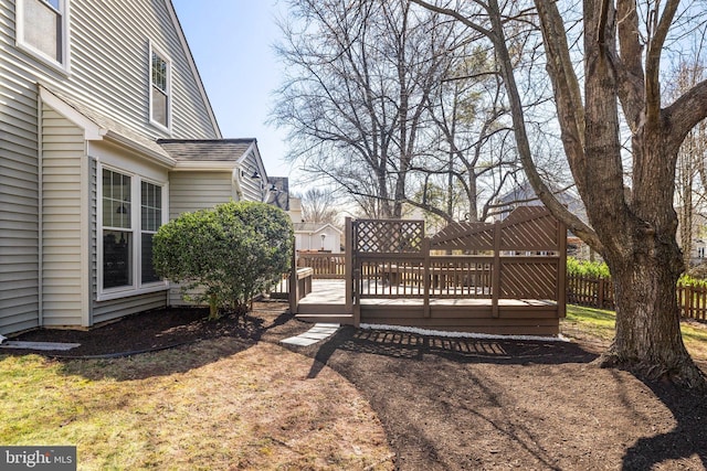 view of yard with a wooden deck and fence