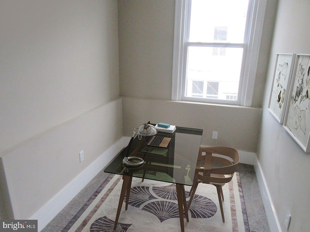 carpeted office with baseboards