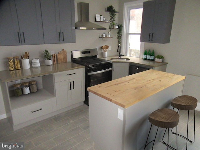 kitchen featuring wooden counters, wall chimney range hood, gas stove, and open shelves