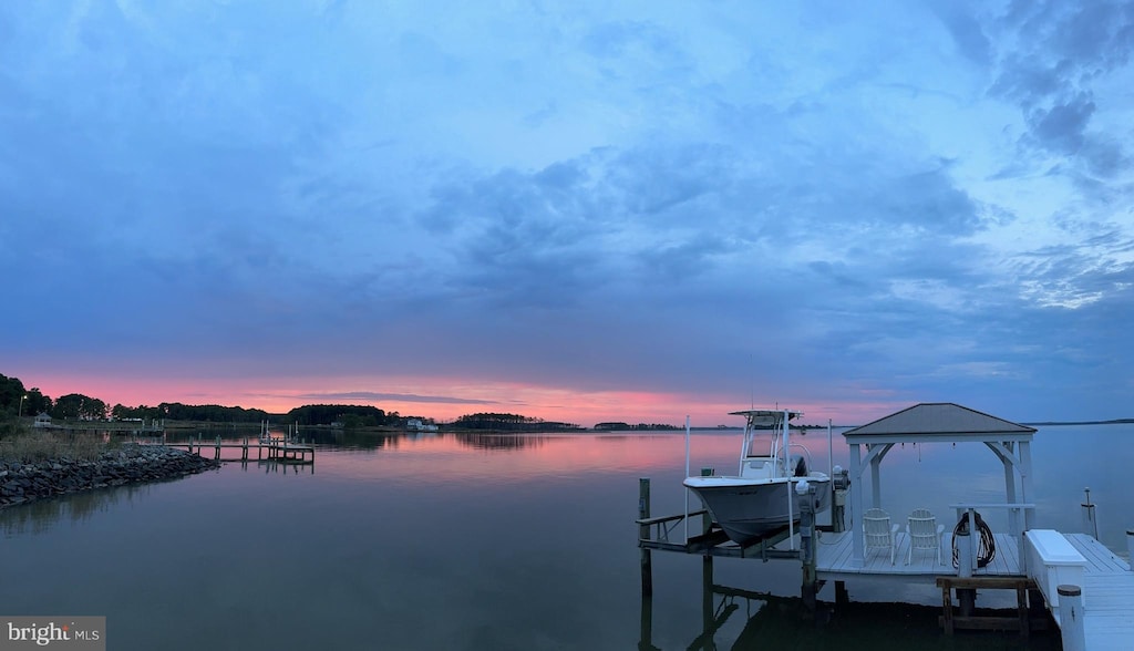 view of dock with a water view and boat lift