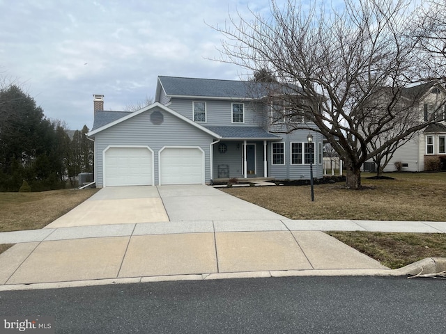 traditional home featuring a shingled roof, a chimney, concrete driveway, a front lawn, and a garage