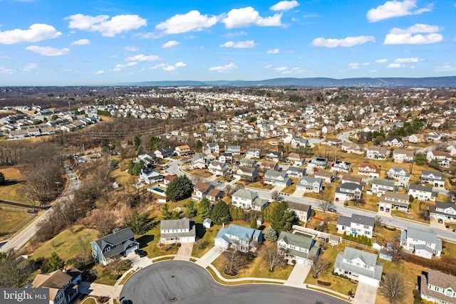 aerial view featuring a mountain view and a residential view