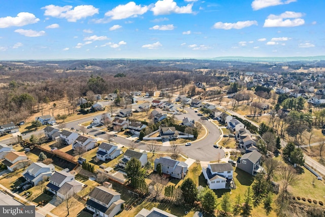 birds eye view of property with a residential view