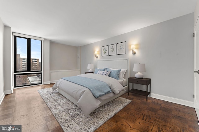 bedroom featuring baseboards