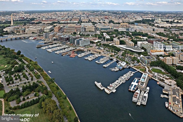 bird's eye view featuring a water view and a city view