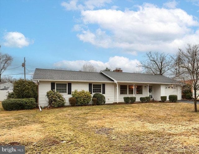 ranch-style home featuring a front lawn, a shingled roof, a chimney, and an attached garage