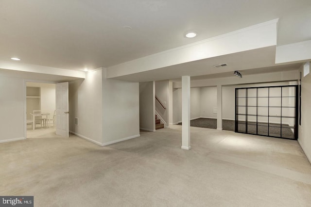 finished basement featuring baseboards, carpet, stairs, crown molding, and recessed lighting