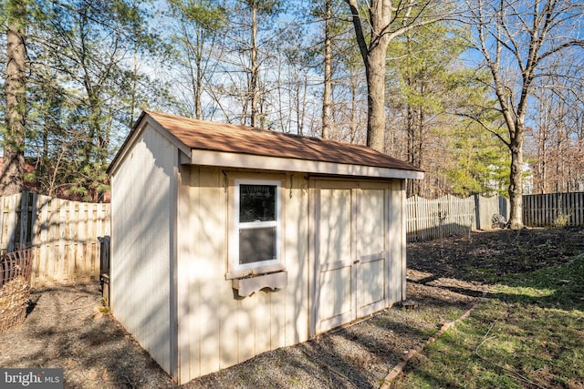 view of shed featuring a fenced backyard