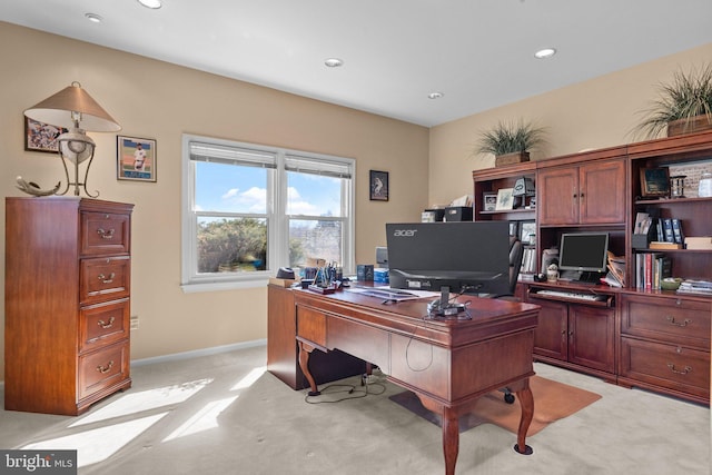 home office featuring recessed lighting, baseboards, and light carpet