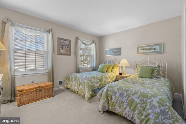 carpeted bedroom with visible vents